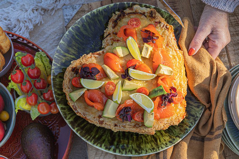 Heart-shaped savory tart with vegetables and lime.