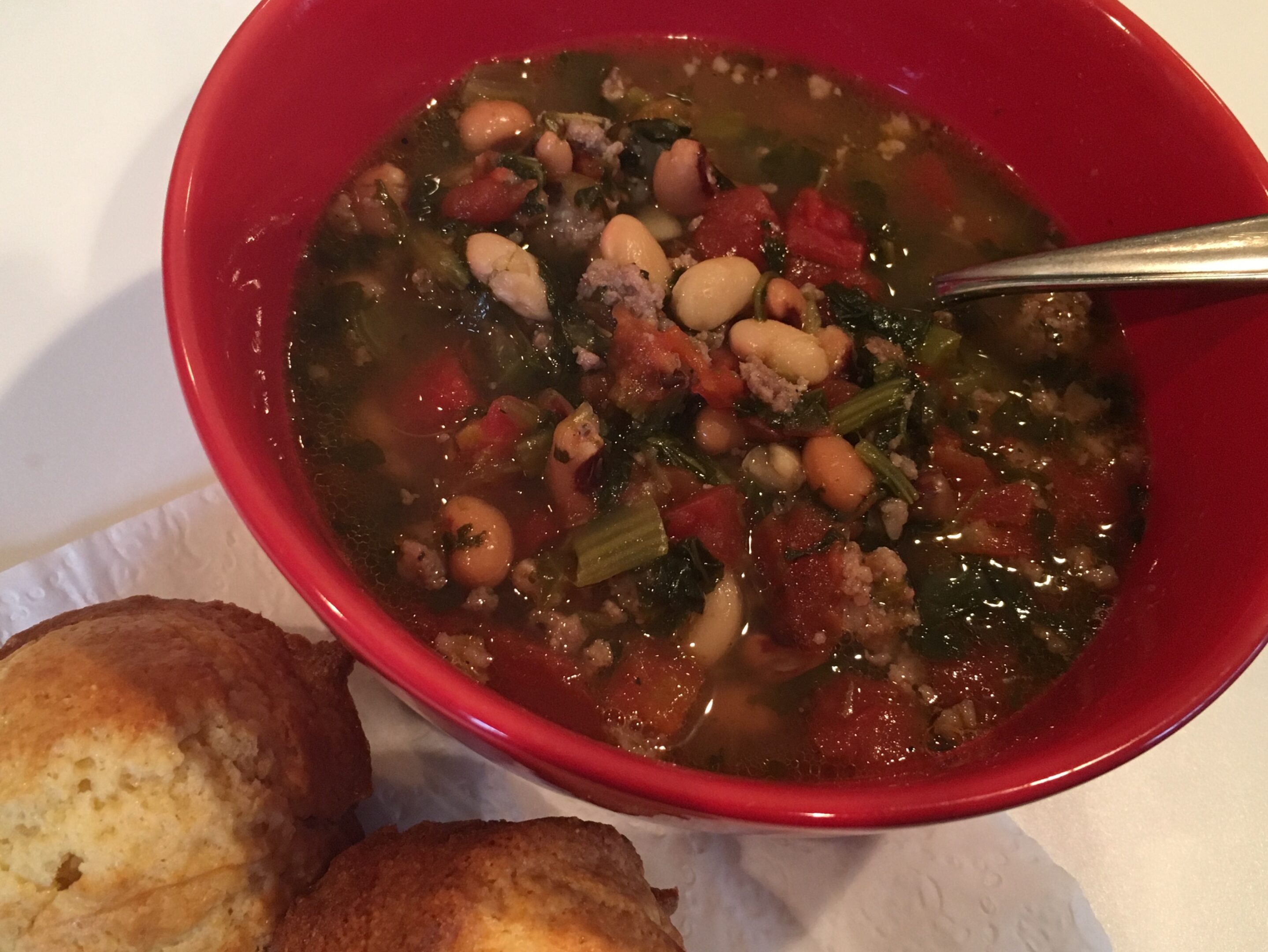 (Upload-from-mobile-1748618413)IMG_3616 A bowl of hearty vegetable and bean soup with a side of bread.